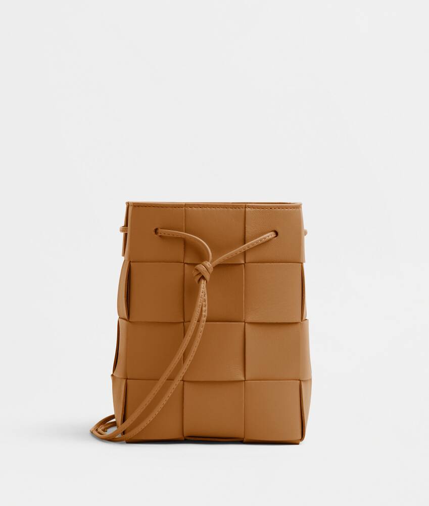 Bottega Veneta® Mini Cassette Bucket Bag in Almond. Shop online now.