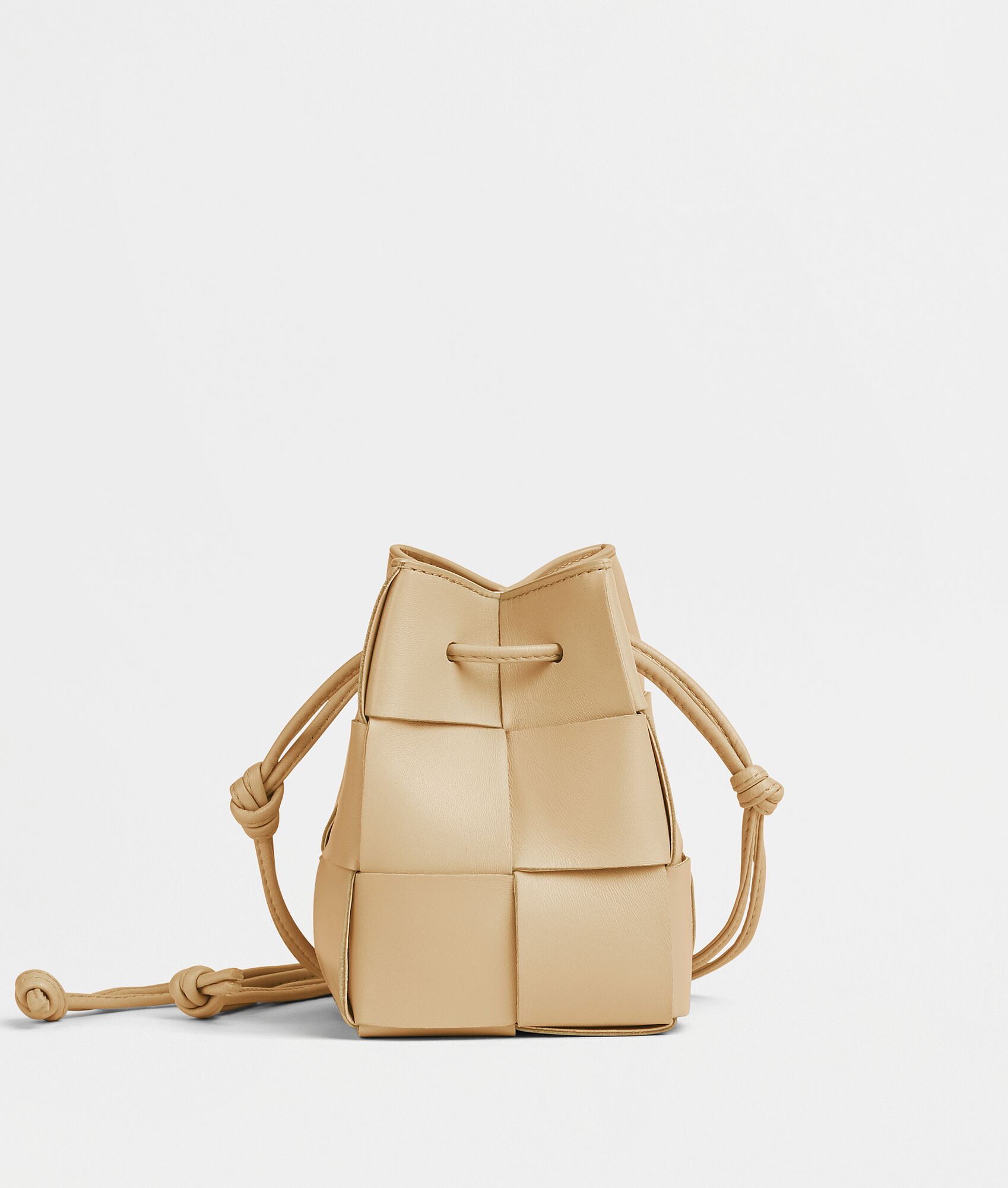 Bottega Veneta® Mini Cassette Bucket Bag in Porridge. Shop online now.