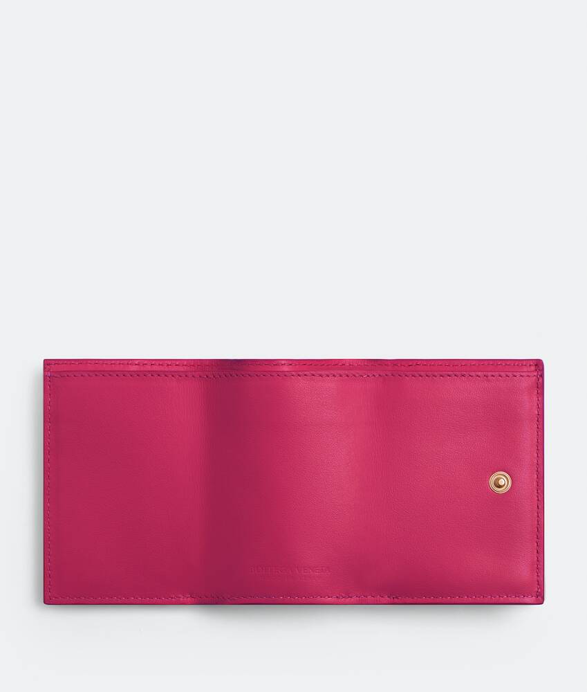 Bottega Veneta® Women's Tiny Tri-Fold Wallet in Cranberry. Shop online now.