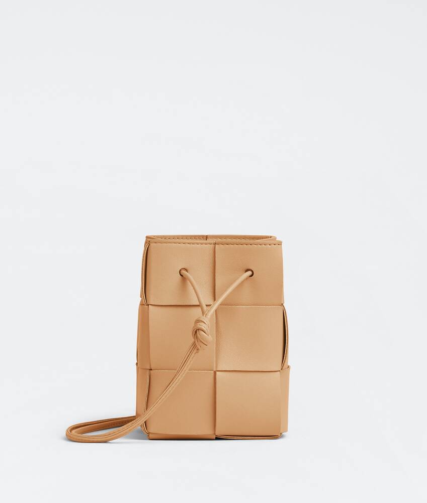 Bottega Veneta® Mini Cassette Bucket Bag in Almond. Shop online now.