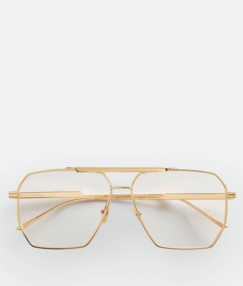 Bottega Veneta® Men's Classic Aviator Sunglasses in Gold / Transparent.  Shop online now.