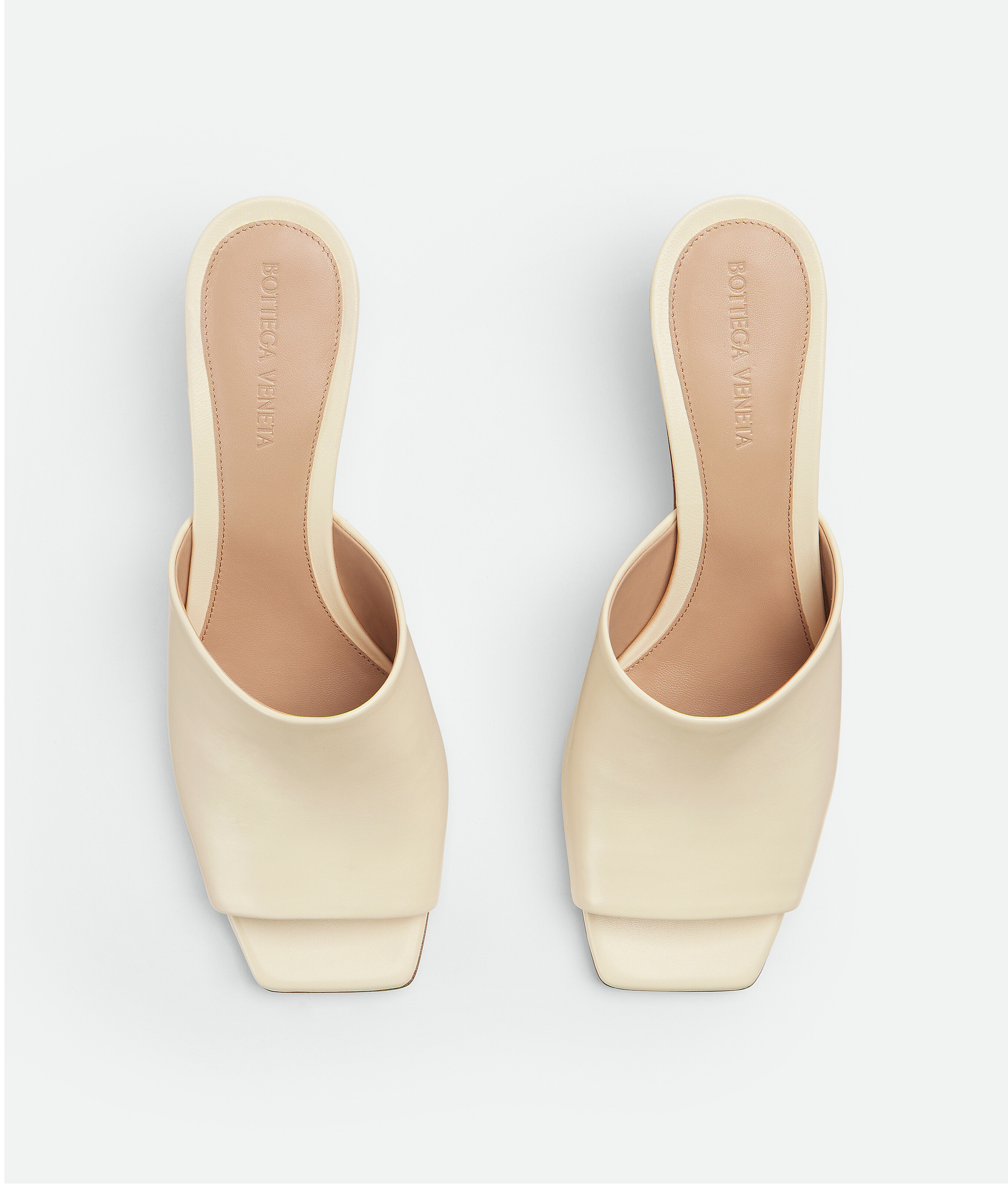 Shop Bottega Veneta Knot Mules In White