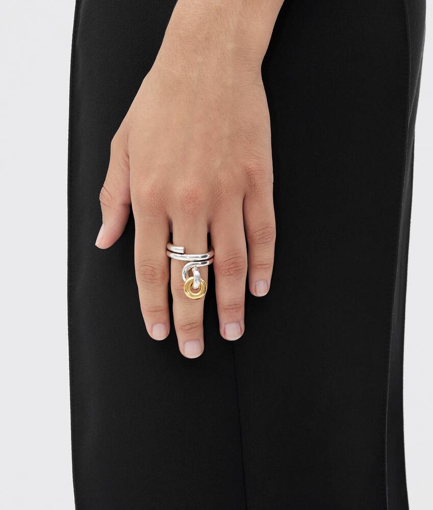 Bottega Veneta® Women's Loop Ring in Silver / Yellow gold. Shop