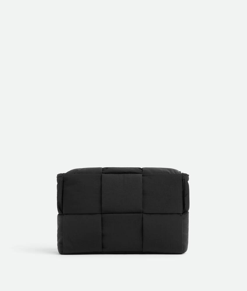 Bottega Veneta® Men's Small Padded Tech Cassette in Black. Shop 