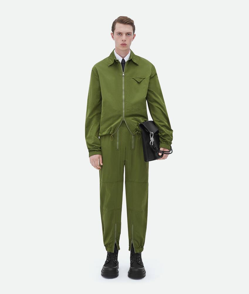 Bottega Veneta® Men's Zipped Nylon Pants in Jalapeno. Shop online now.