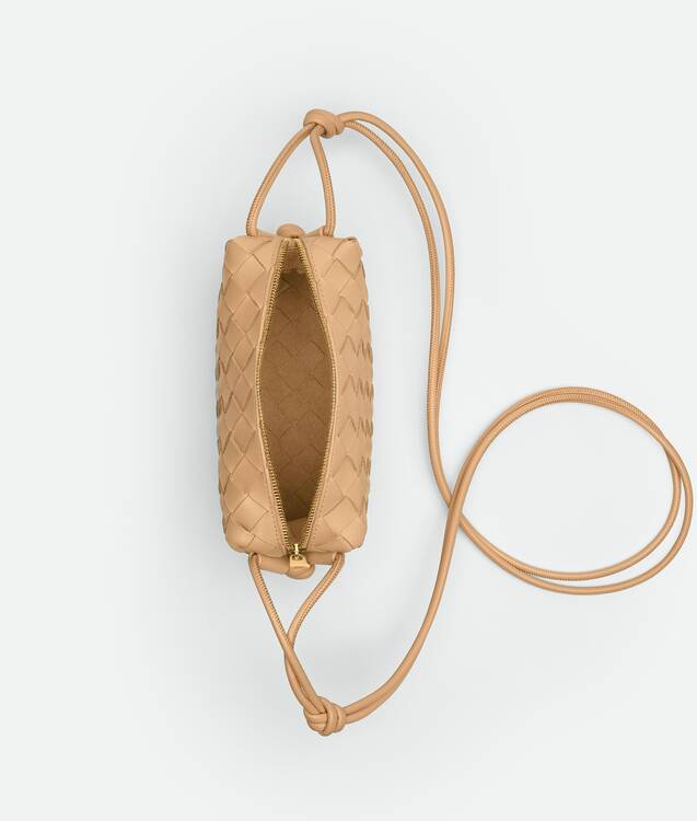 Bottega Veneta® Women's Mini Loop Camera Bag in Almond. Shop online now.