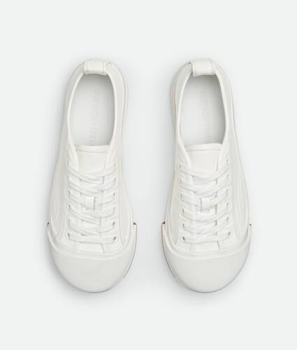 Bottega Veneta® Women's Orbit Sneaker in Silver / White / Optic White  Rubber. Shop online now.