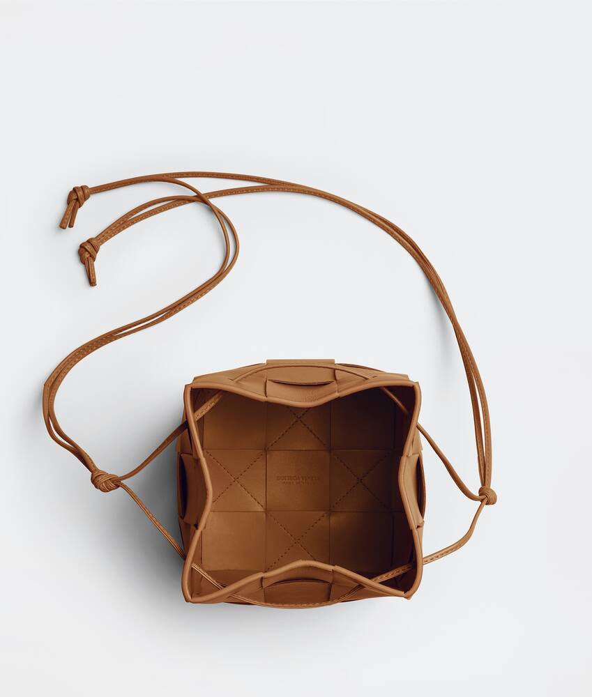 Bottega Veneta® Mini Cassette Bucket Bag in Porridge. Shop online now.