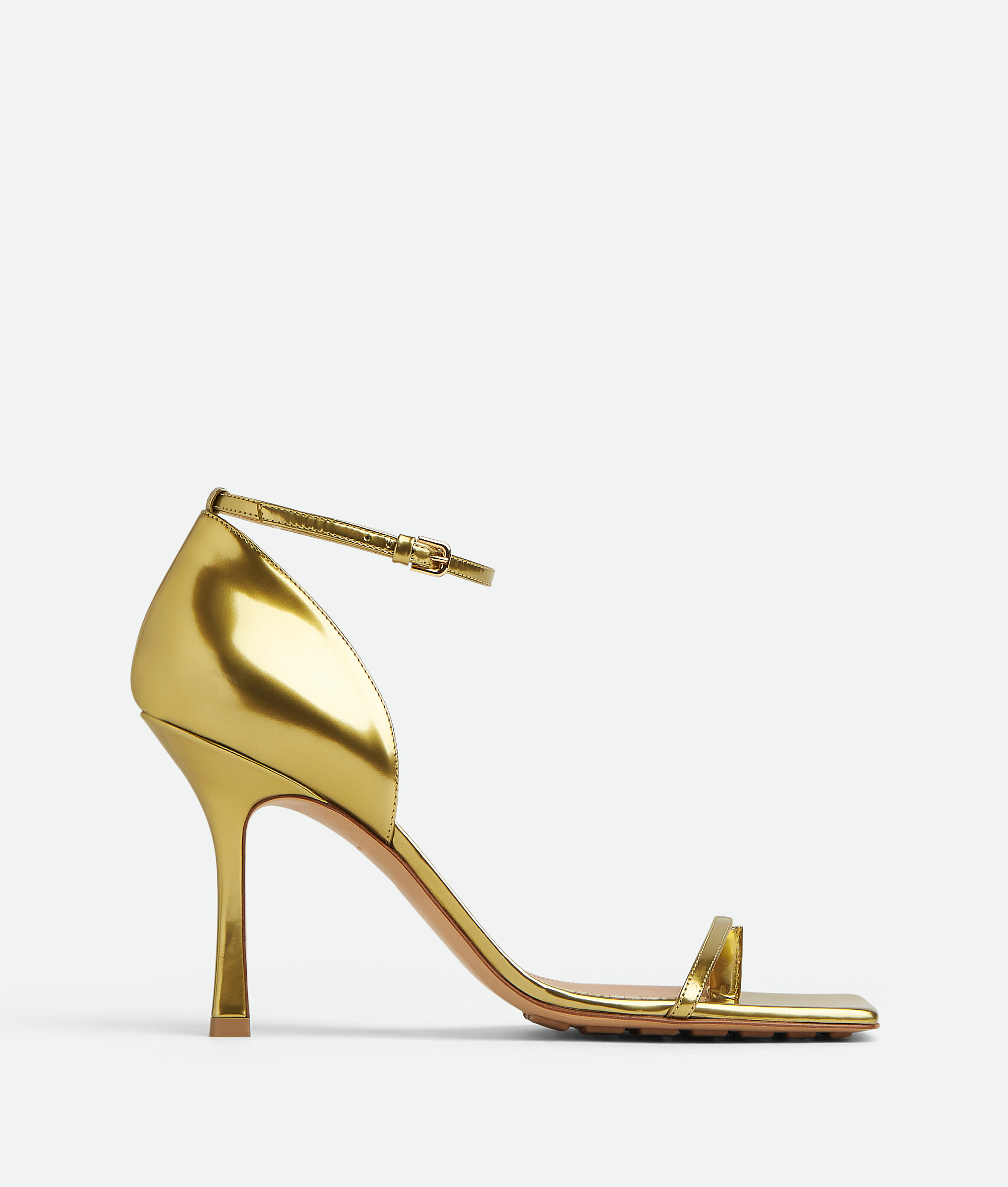 Bottega Veneta® Women's Stretch Strap Sandal in Gold. Shop online now.