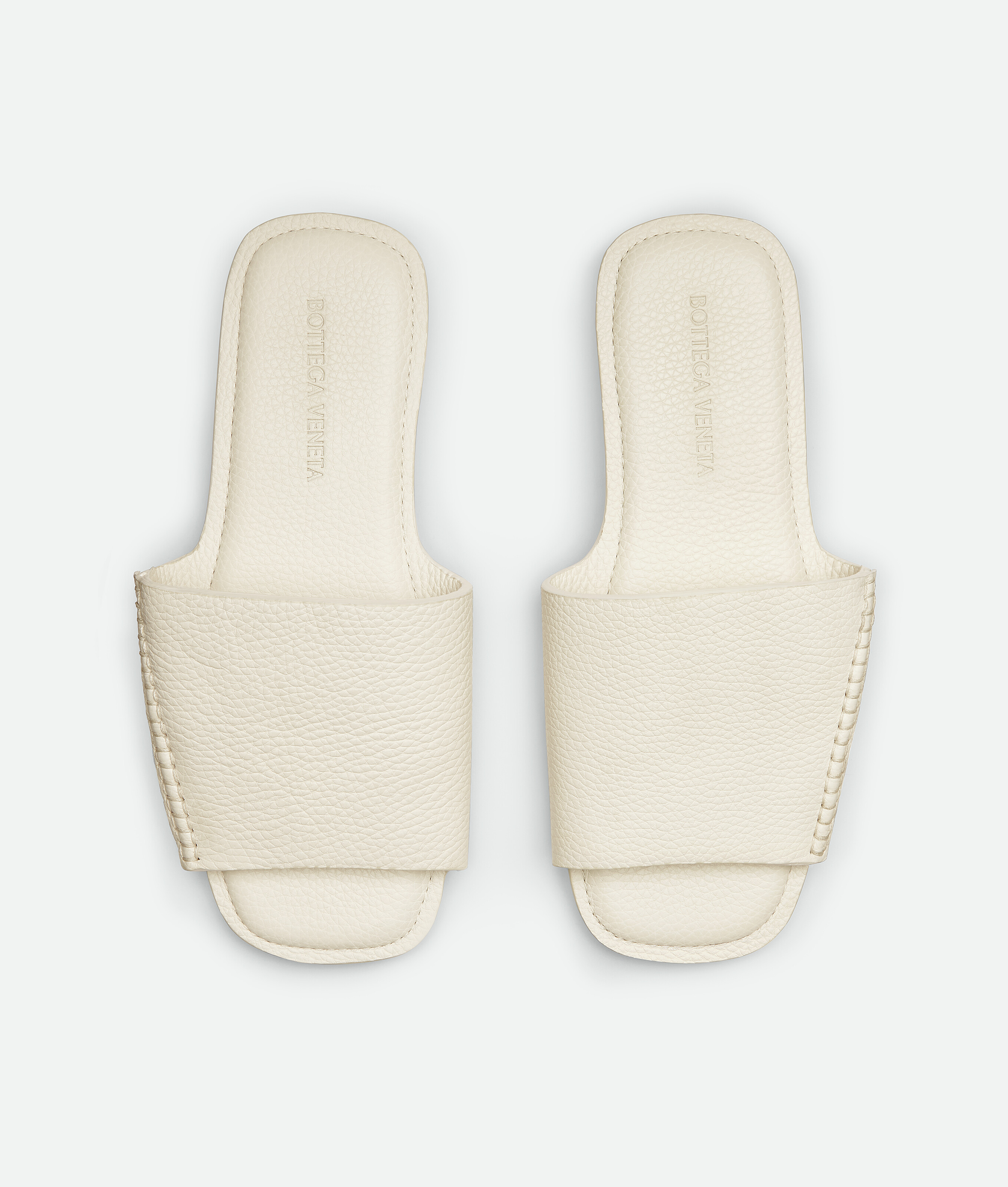 Shop Bottega Veneta Shore Mules In String