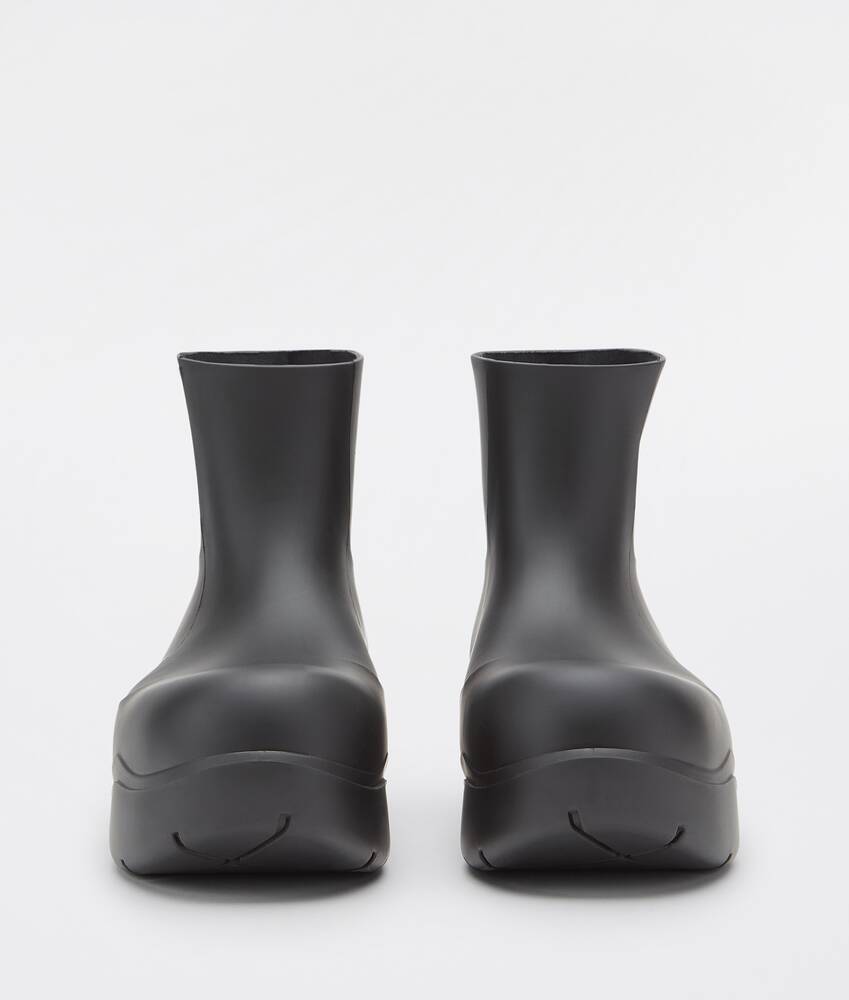 Bottega Veneta® Men's Puddle Ankle Boot in Black. Shop online now.