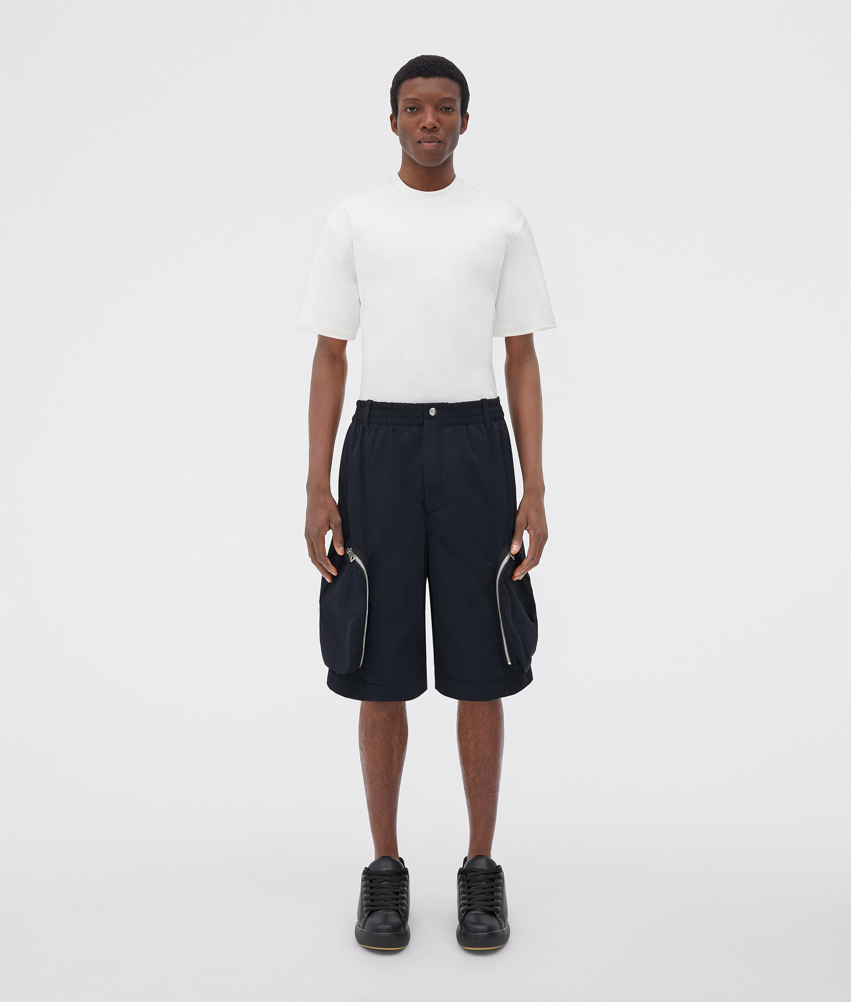 Bottega Veneta® Men's Nylon Cargo Shorts in Dark Navy. Shop online