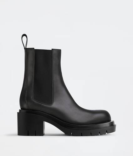 Bottega Veneta® Women's Lug Chelsea Boot in Black. Shop online now.