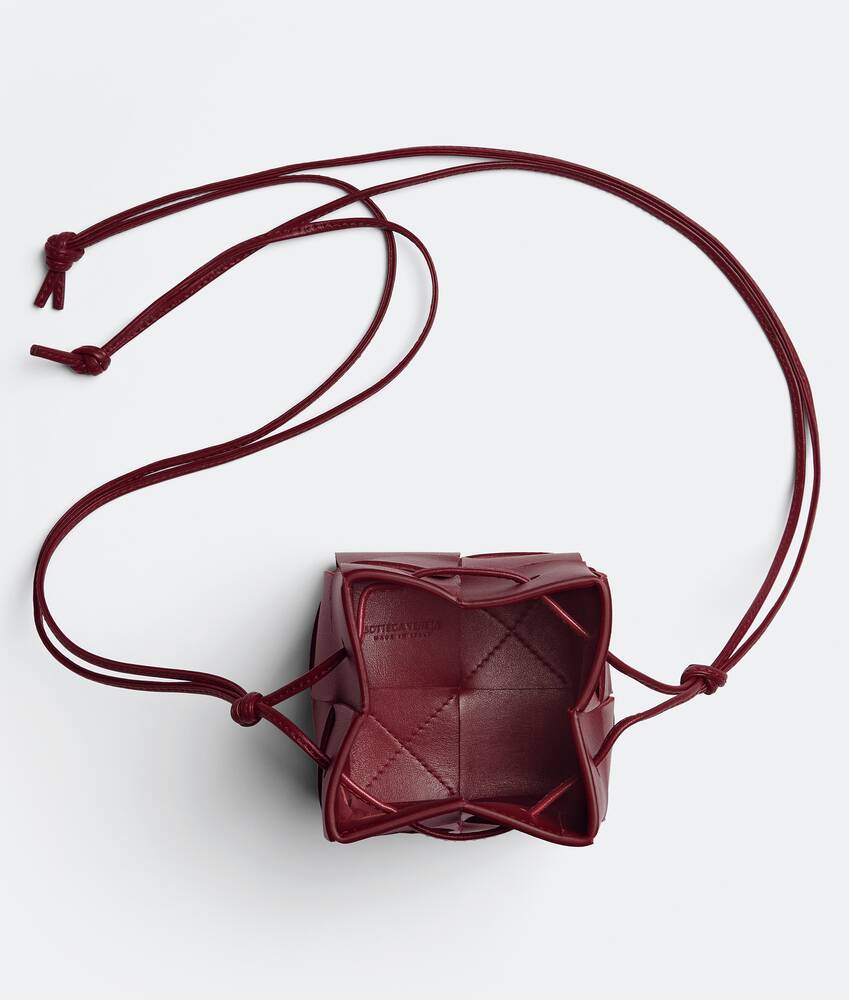 Bottega Veneta® Mini Cassette Bucket Bag in Bordeaux. Shop online now.