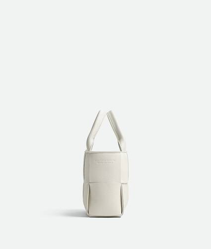 Bottega Veneta® Women's Candy Arco Tote Bag in White. Shop online now.